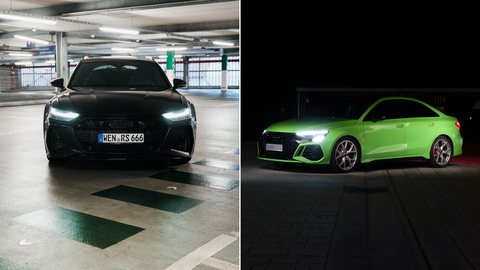 Schwarzer Audi RS6 Avant und grüne Audi RS3 Limousine nebeneinander